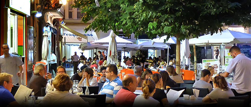 Outdoor dining  crowds in Malaga, Spain