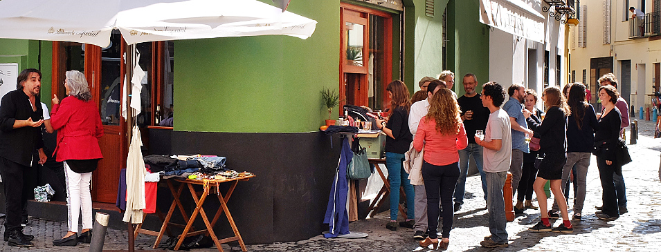 Street Party Sevilla neighborhood bars often serve drinks and tapas to customers outside in the street. 
Here neighbors meet on a Saturday afternoon for a street party that could continue into the evening. in Sevilla Spain